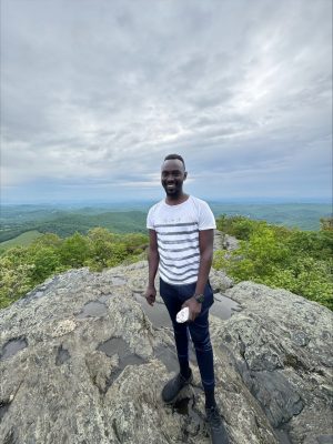 student on top of the mountain