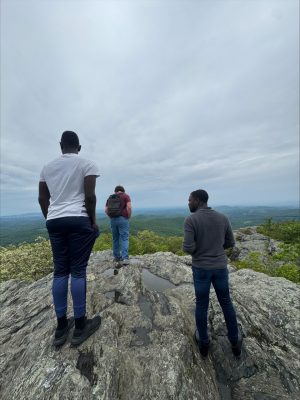 student on top of the mountain