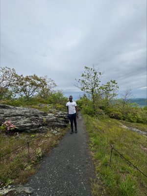 student on top of the mountain