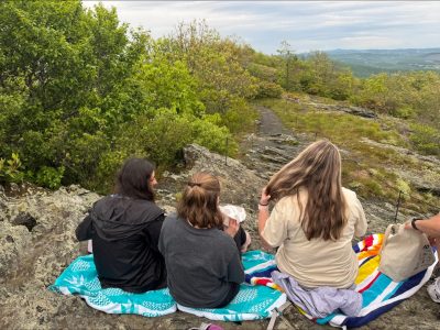 student on top of the mountain
