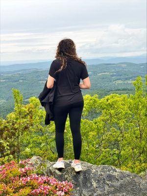 student on top of the mountain